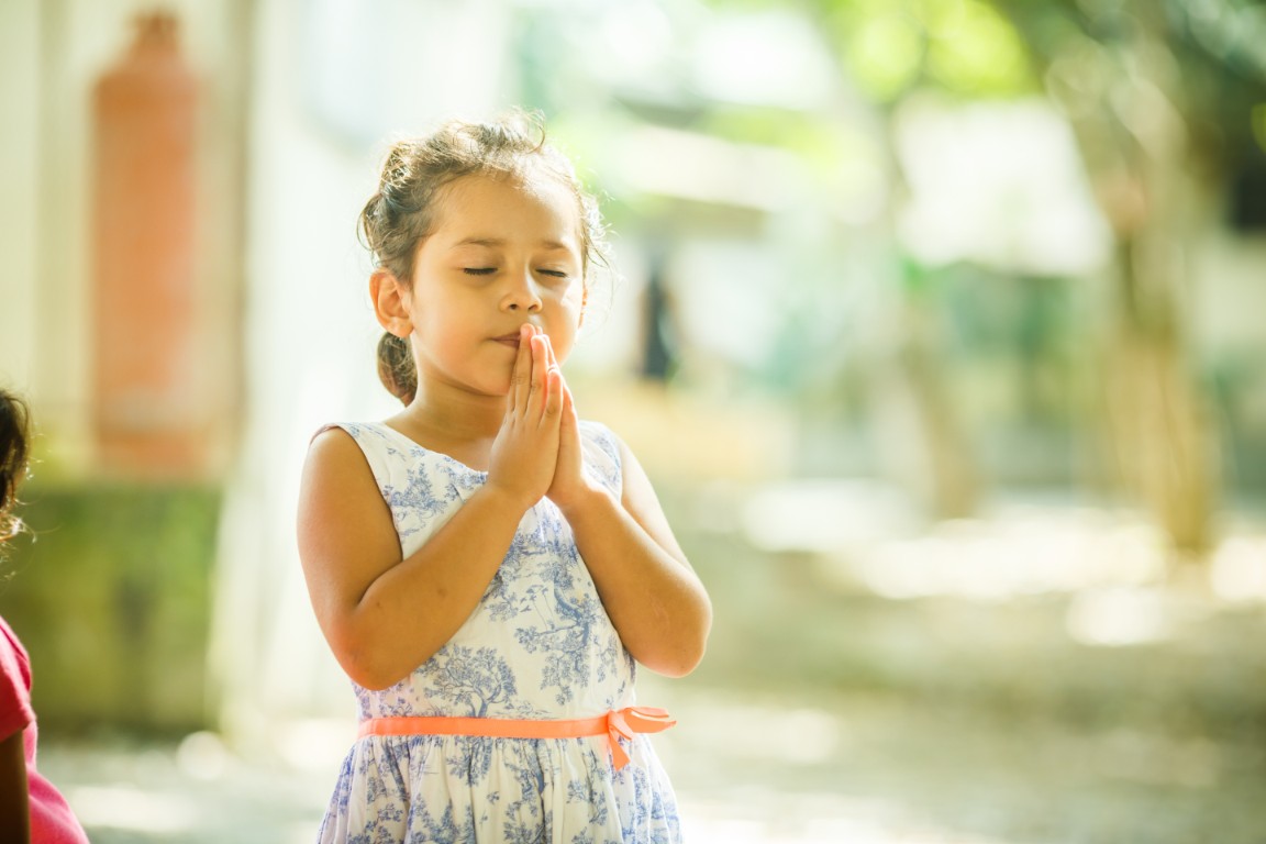 photo of girl praying