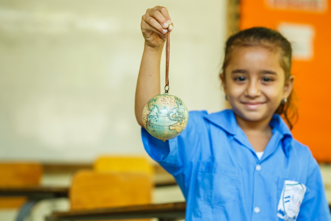 Photo of girl with globe