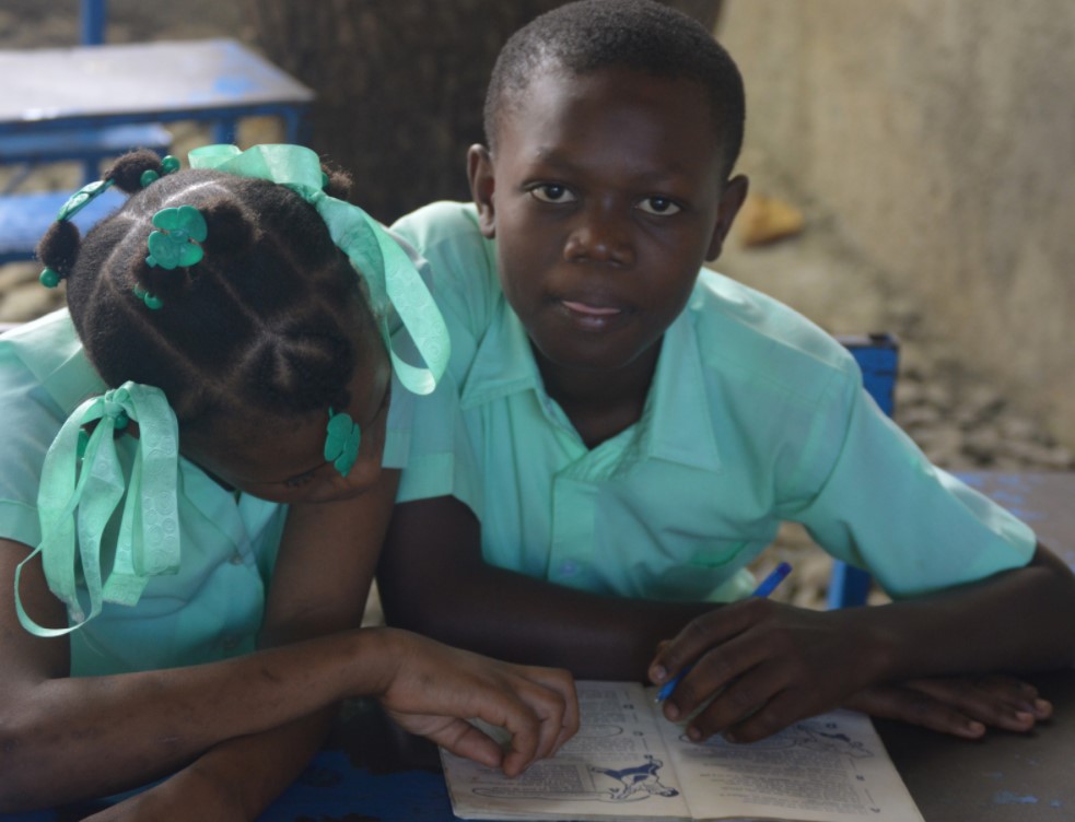Photo of some children at their desks in 6th Grade