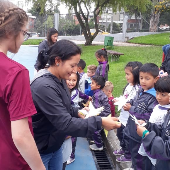 Photo of Sara with Students