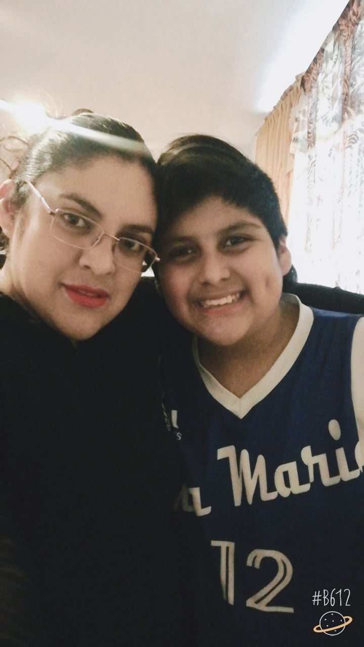 Photo of Patricio, a 7th grade student, with his mom.