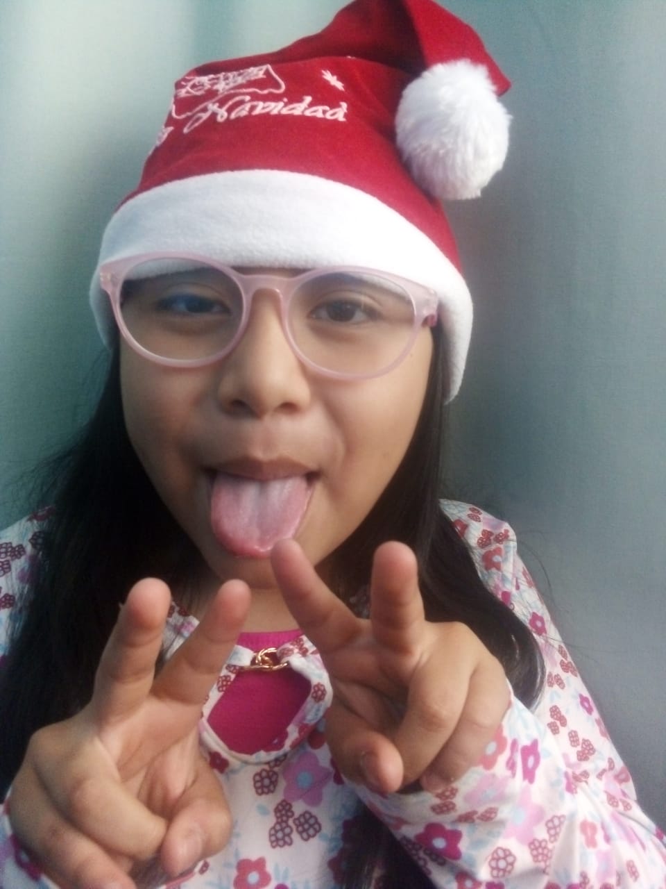 Photo of Keila, a 3rd grade student in Ecuador, at Christmas time. 
