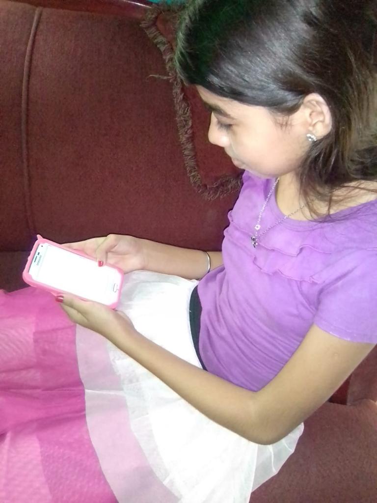 Photo of child doing school online