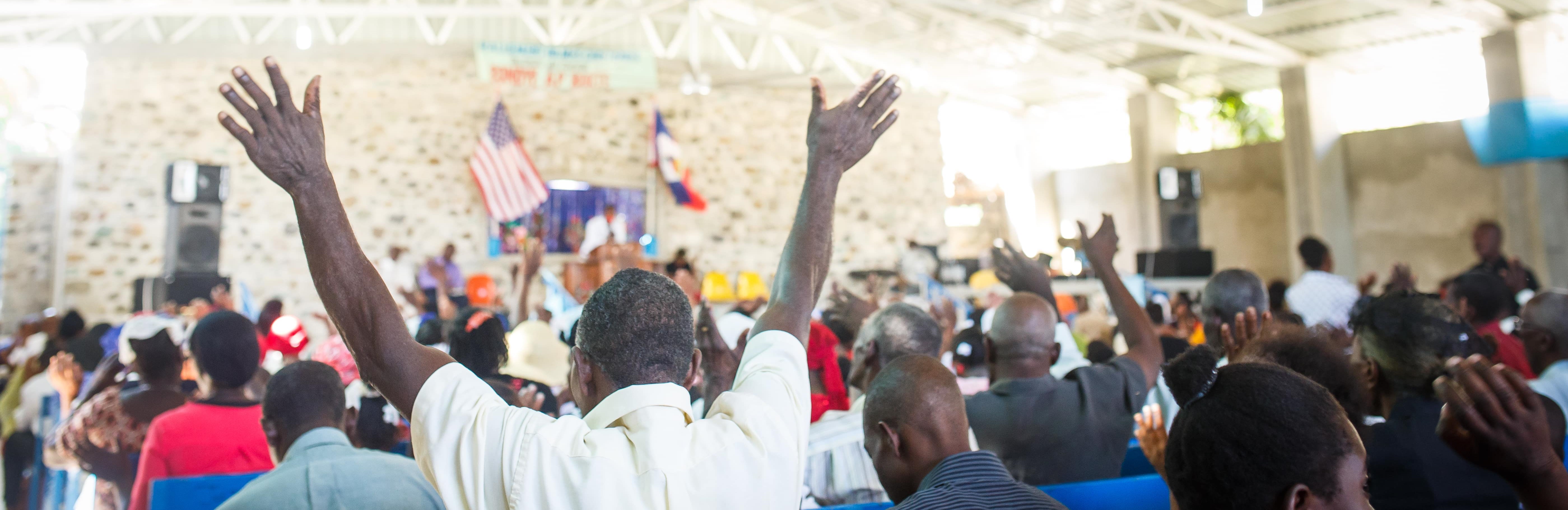 praying in church in Haiti